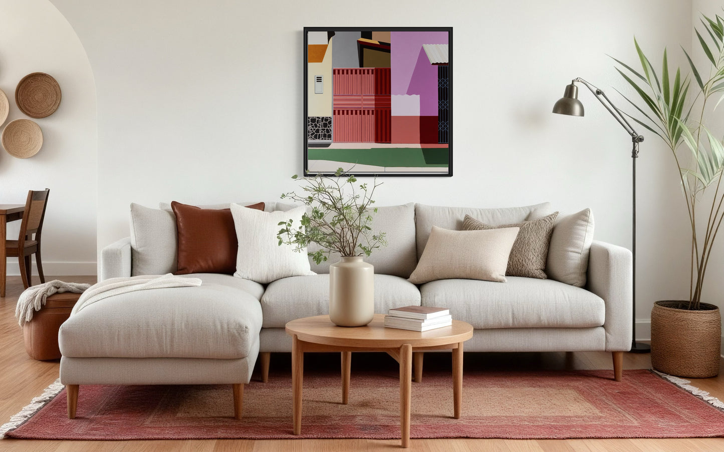 Modern living room with a sofa, coffee table, and Gordon Leverton original art on the wall.