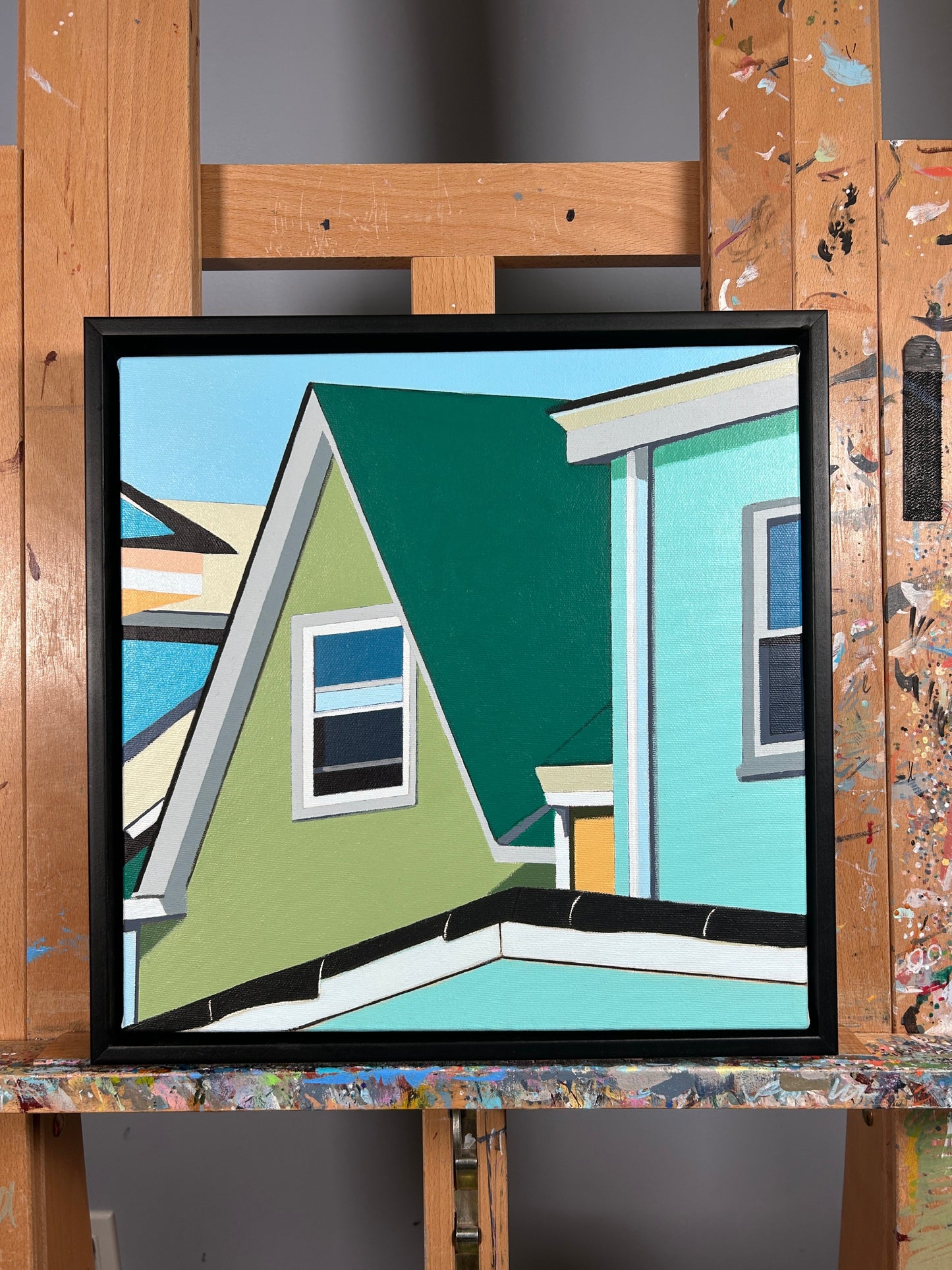 Original acrylic painting Peace Division by Gordon Leverton depicting colorful row houses on Barton Street Hamilton with green blue and yellow facades