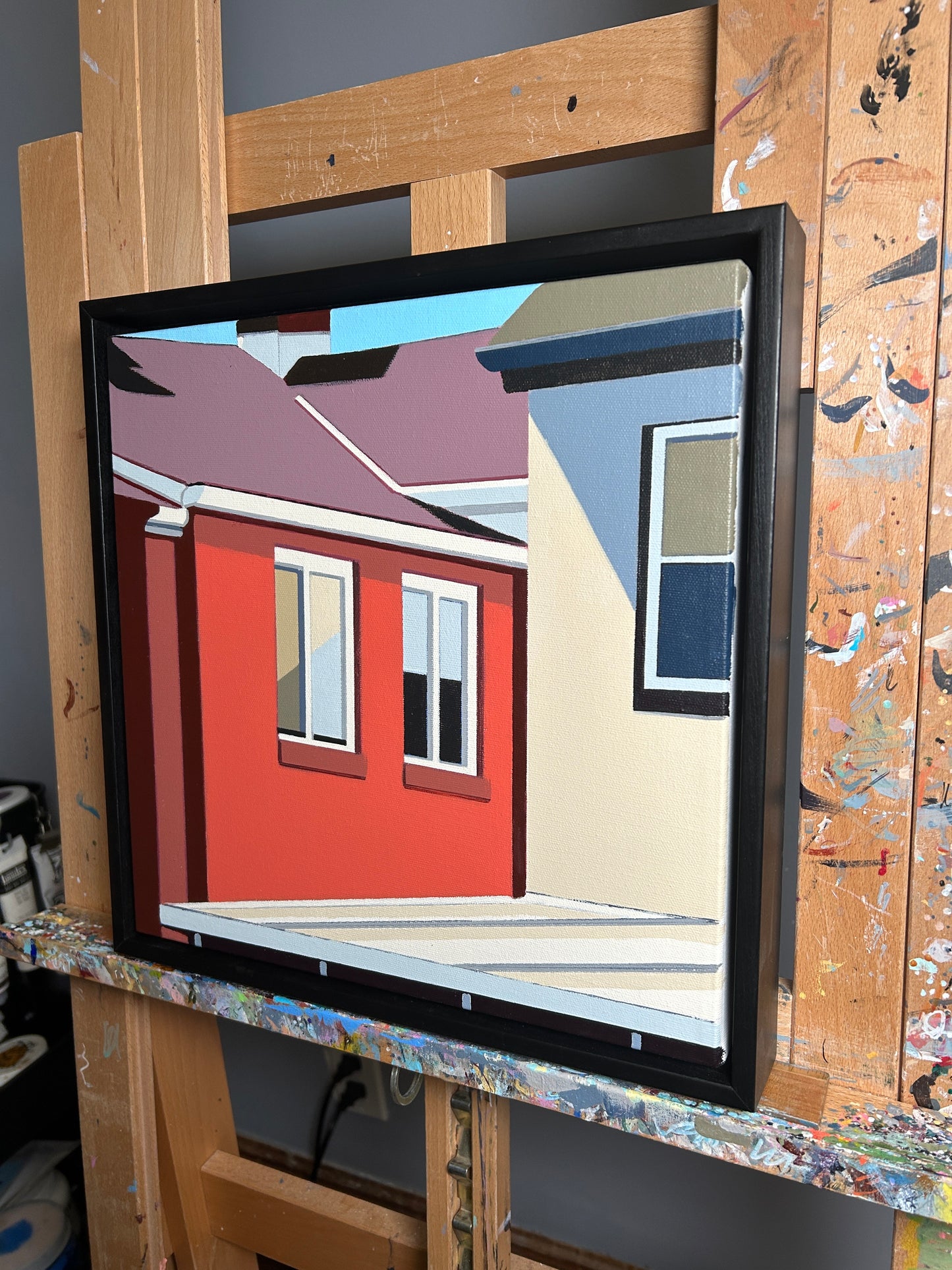Original acrylic painting Squared Up by Gordon Leverton depicting colorful row houses in Strathcona Hamilton with green blue and yellow facades