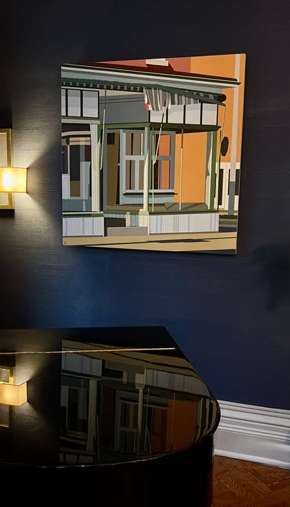 Photo taken of Vintage Charm, Gordon Leverton in The Hamilton Club, Hamilton, Canada in December 2025. Original acrylic painting Vintage Charm by Gordon Leverton depicting 313 Barton Street corner building in Hamilton with historic storefront architecture - Grocery Store for over 73 years.