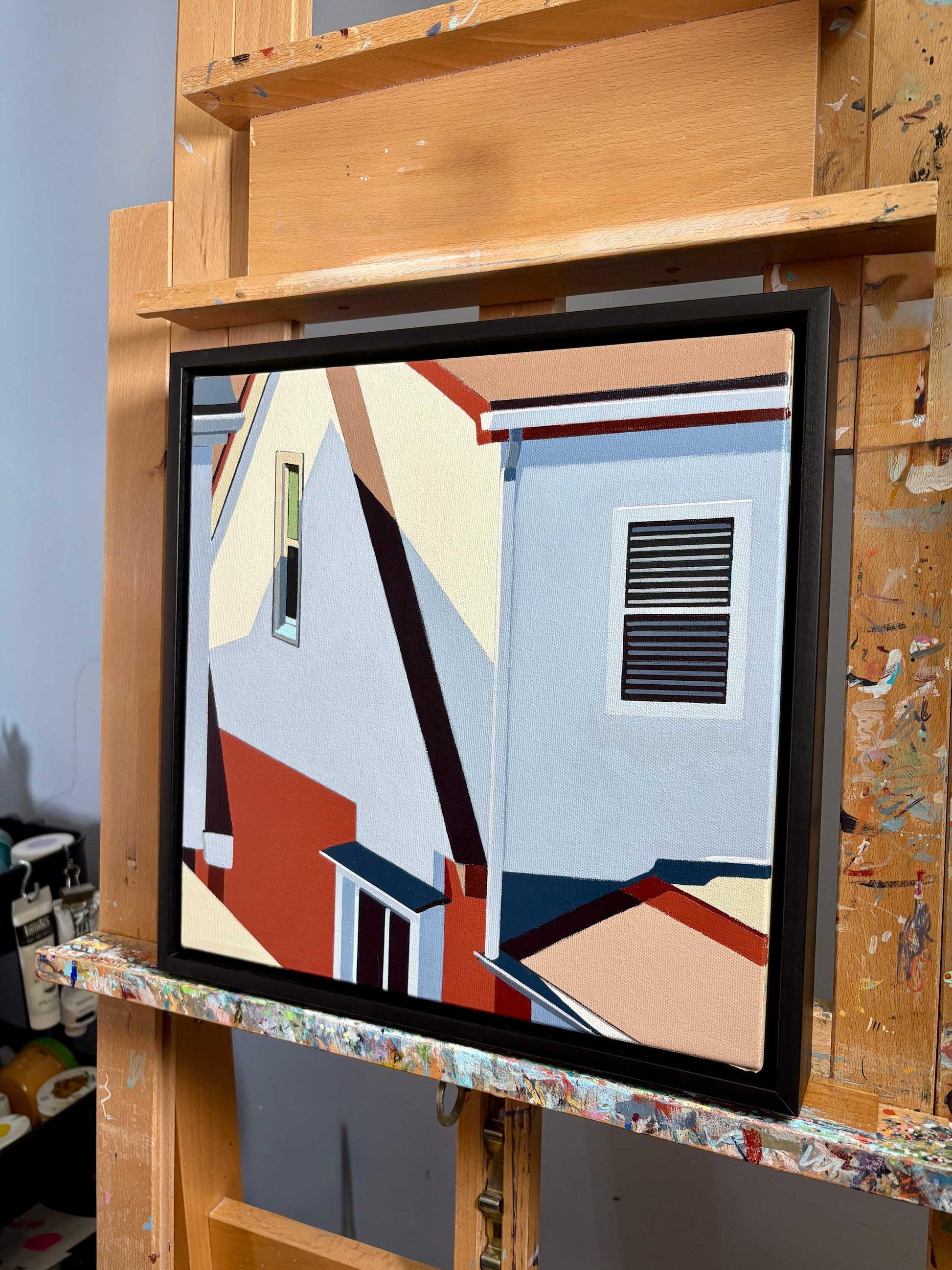 Hindsight is an original 12x12 inch painting by Gordon Leverton, Hamilton Artist, featuring architectural painting of a side view homes in Toronto, Canada in bold geometric shapes.