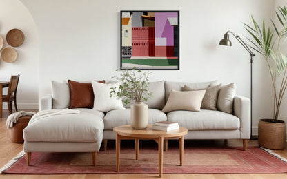 Modern living room with a sofa, coffee table, and Gordon Leverton original art on the wall.